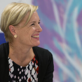 Cecile is a blonde middle aged woman (in this photo) with a short haircut and smiling in profile